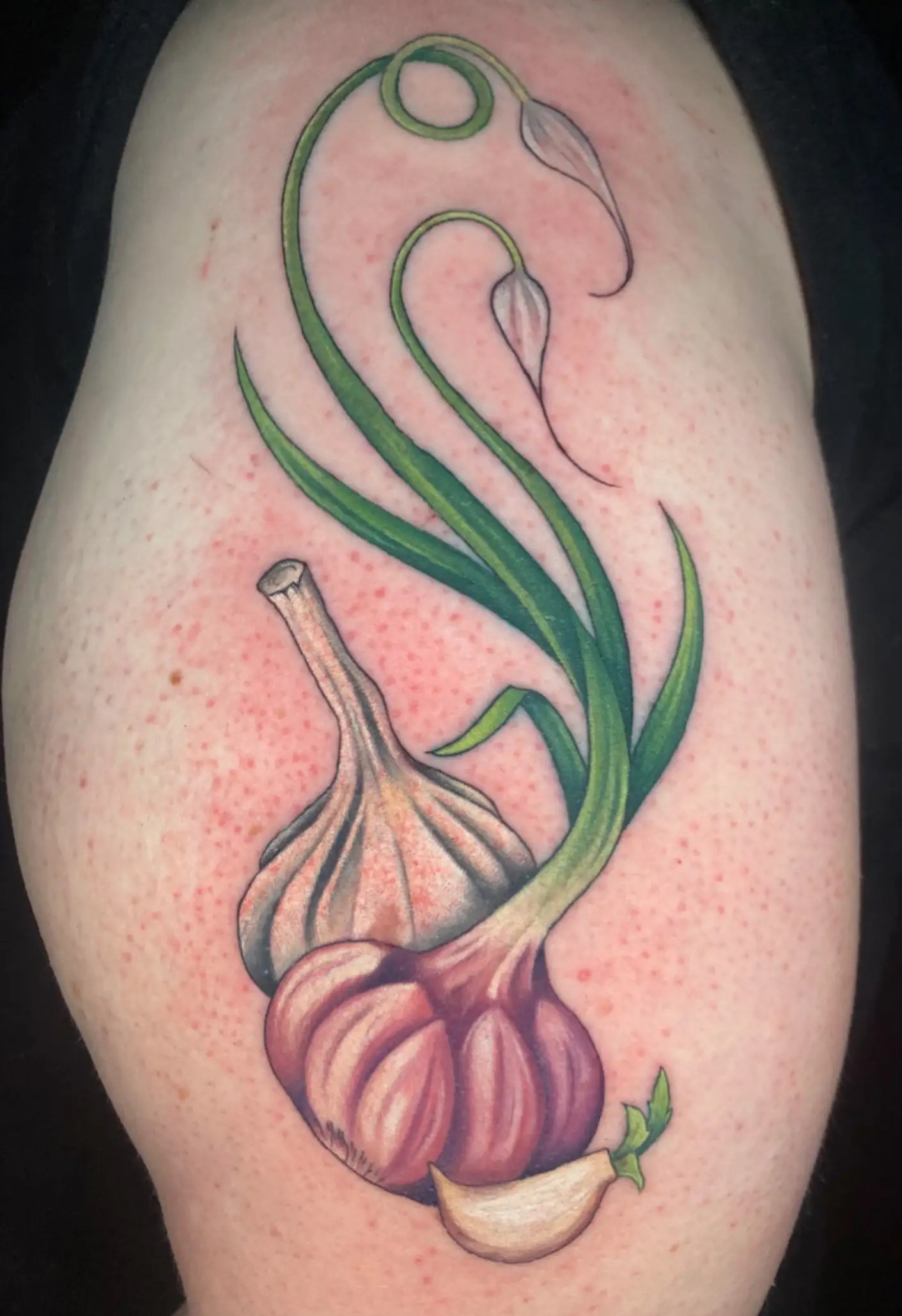 Realistic garlic plant tattoo