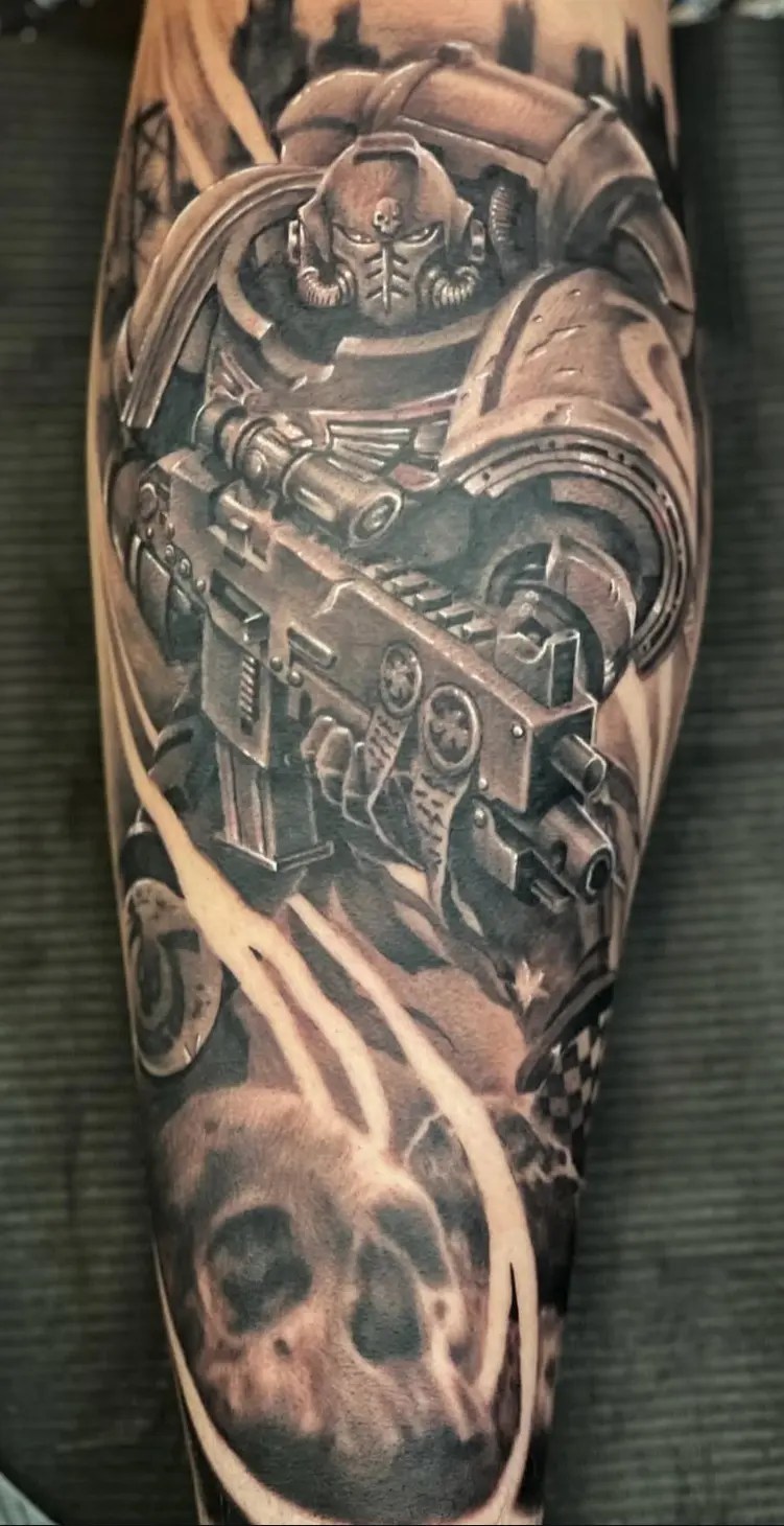 Black and grey tattoo of a robot with a gun and skull