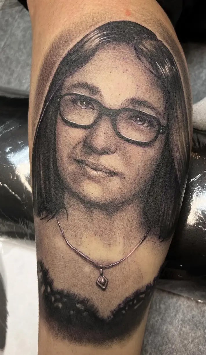 Black and grey portrait tattoo of a girl