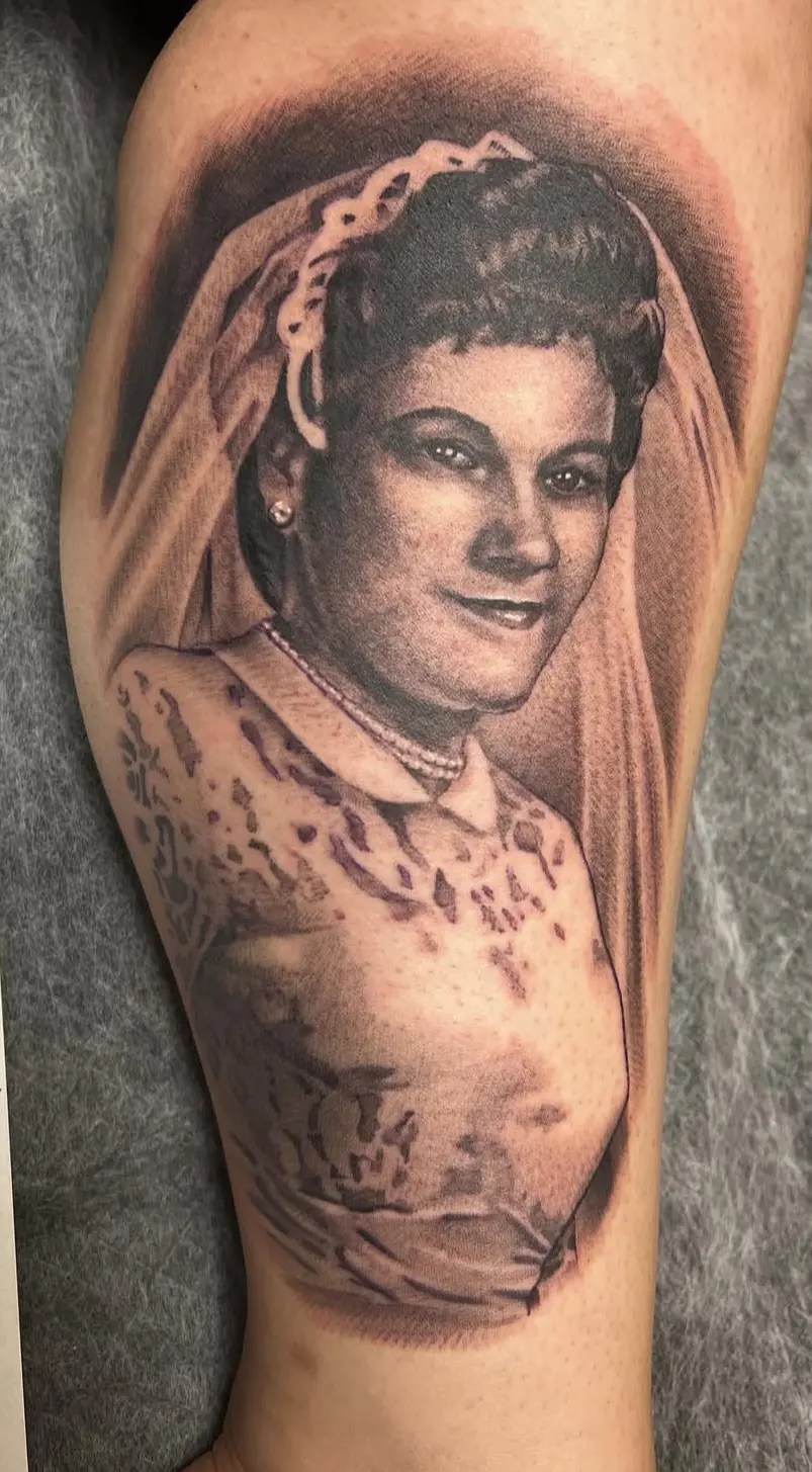 Black and grey portrait tattoo of a woman