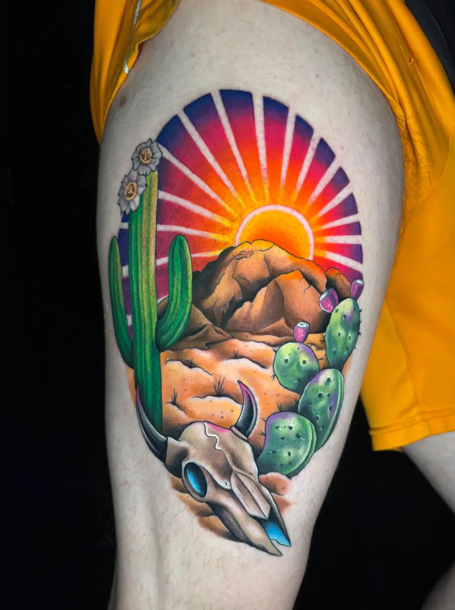 Colorful tattoo of a desert scene