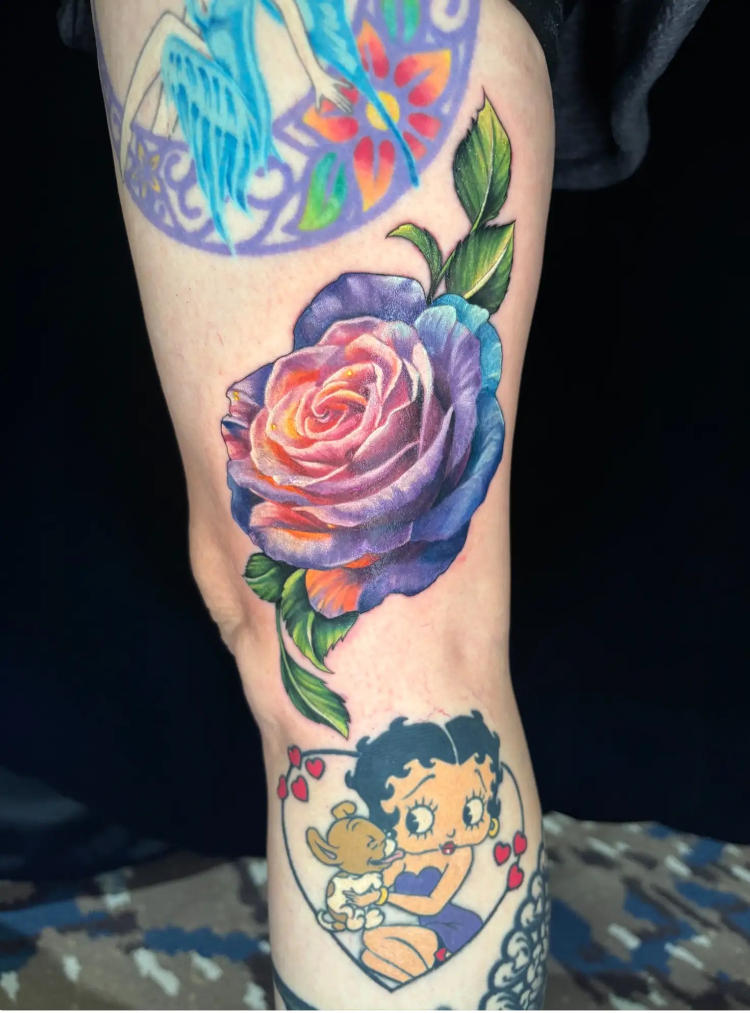Realistic and colorful tattoo of a rose