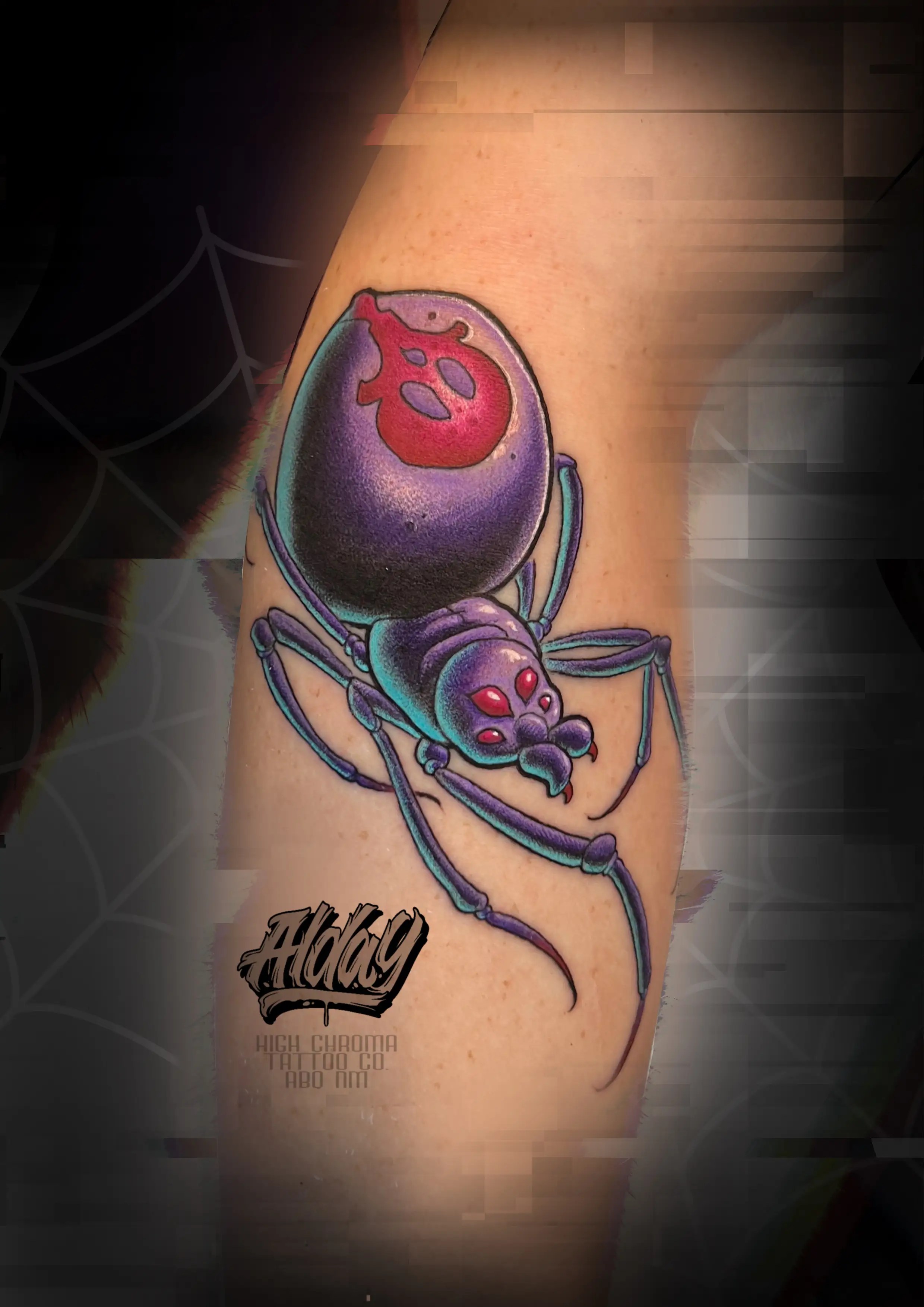 New school styled tattoo of a black widow spider